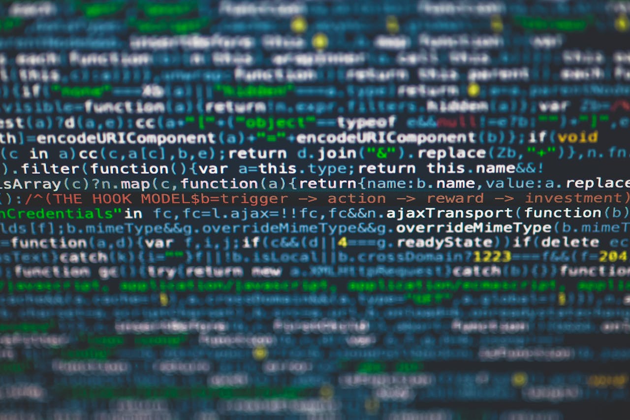 about-us Detailed view of colorful programming code on a computer screen.