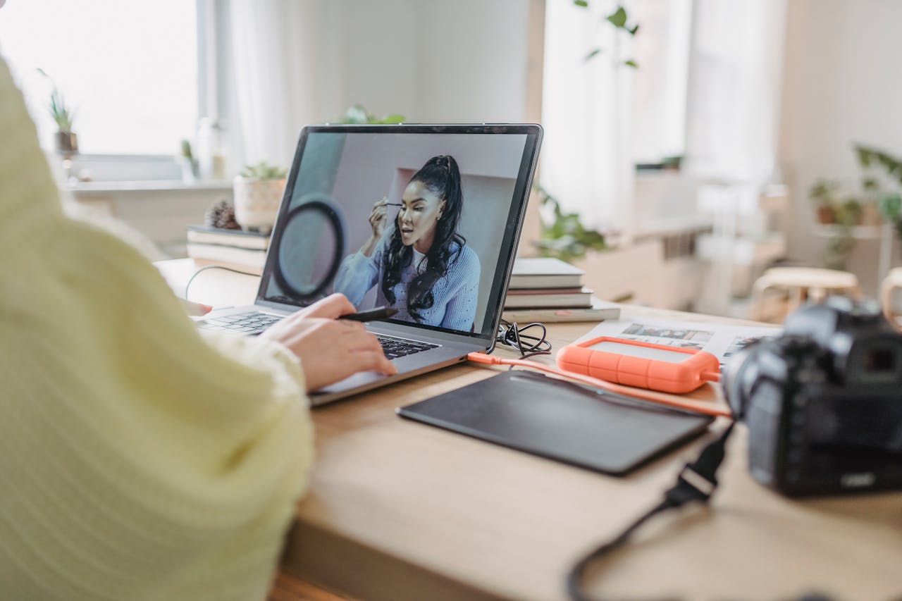 Crafting Captivating Headlines: Your awesome post title goes here Crop unrecognizable female photographer editing photo while sitting at table with photo camera and graphic tablet during work in spacious room with flowerpots